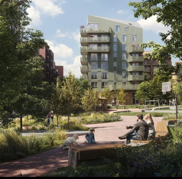 Lille Løren park, teglfasader med innslag av puss i ulike farger, og trekledning. Oppbrutte volumer, og grønne og frodige utearealer.