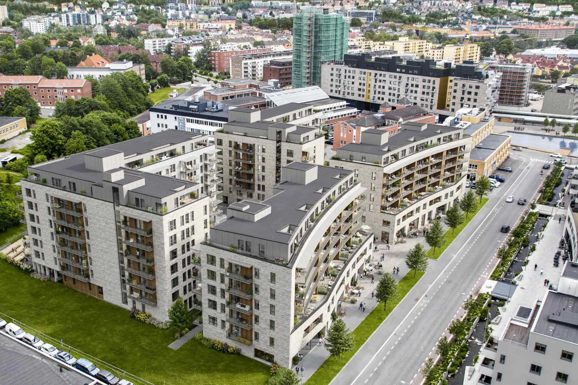 Locus Ensjø, Gladengveien. Fasaden har lys tegl i kombinasjon med malt panel og lys platekledning. Bygningen er buet mot Ellipseplassen. Bygningene leker med form og dybde, med utkragede balkonger, og inntrukne partier.