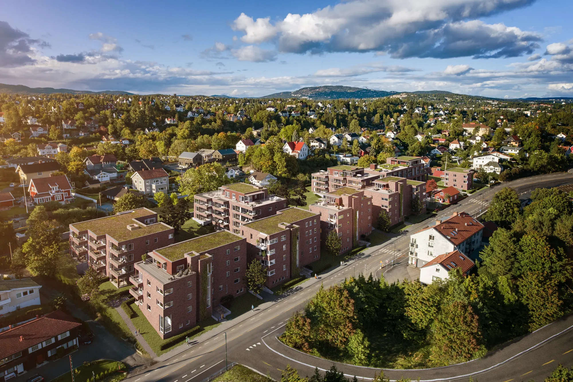 smedens hage, professor kohts vei på Stabekk. Rød tegl binder bebyggelsen sammen. Hvite vinduer, og integrerte balkonger skaper variasjon og kontrast.